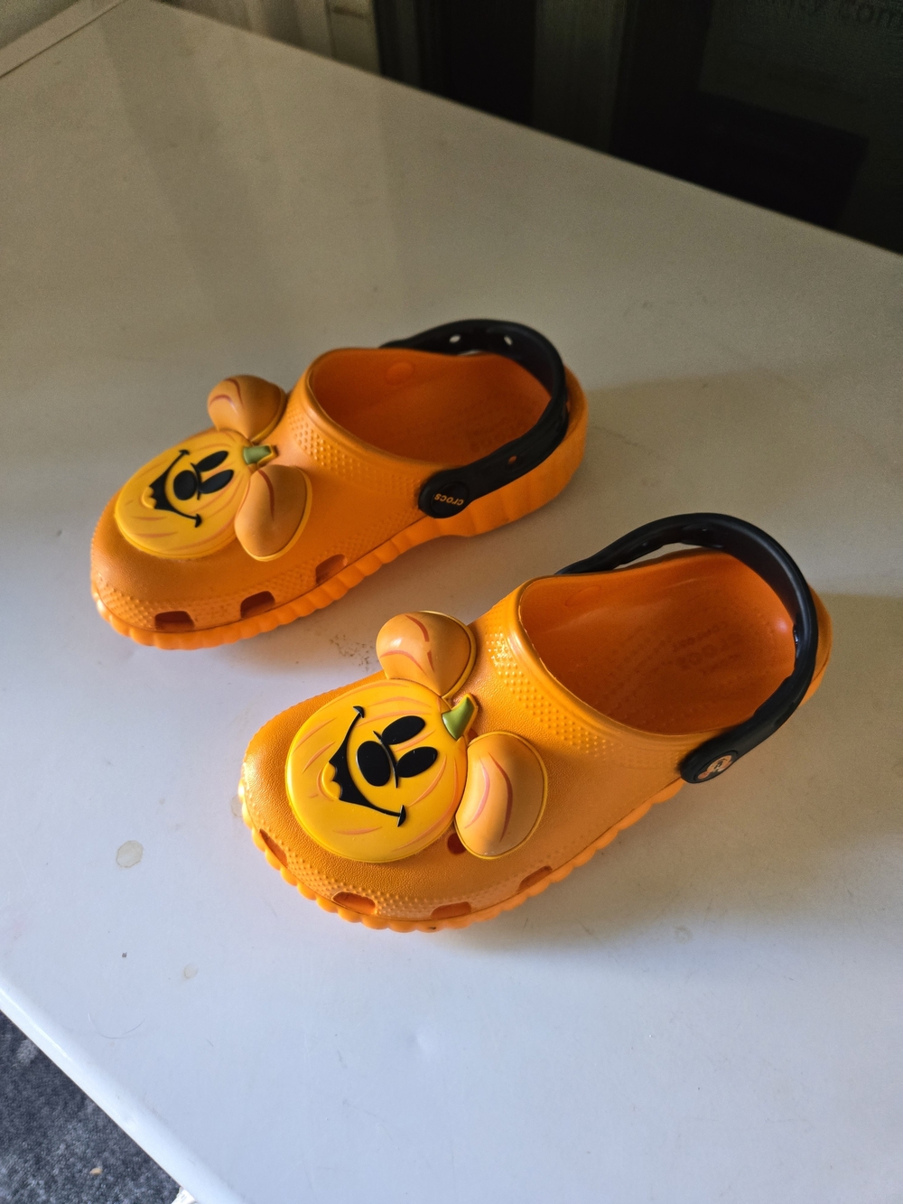 CROCS Kids Orange Pumpkin Clogs with Black Heel Strap